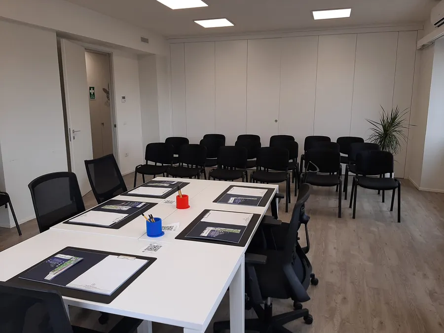 40 sqm private office at Hub Florence set up for a meeting or presentation
